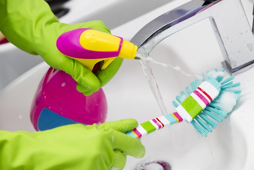 Professional home cleaners in an Islington living room
