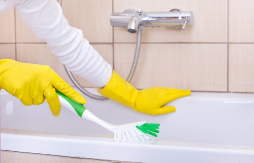 Professional oven cleaner in Islington removing grease from a kitchen oven