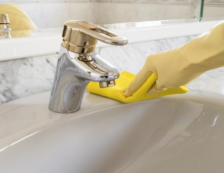 Professional office cleaning team sanitising desks and communal spaces in Islington
